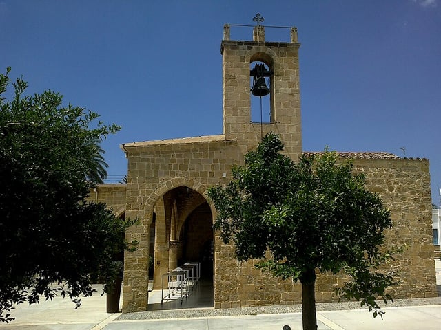 Panagia Chrysaliniotissa's stone bell tower over its arched front