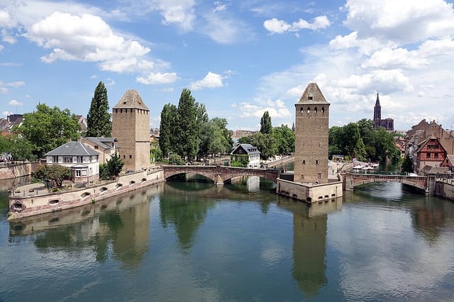 The towers of the Ponts Couverts across the Ill, with the cathedral spire behind